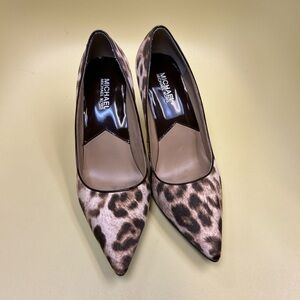 Michael Kors cheetah print heels. Size 7.5
The bottoms have been done